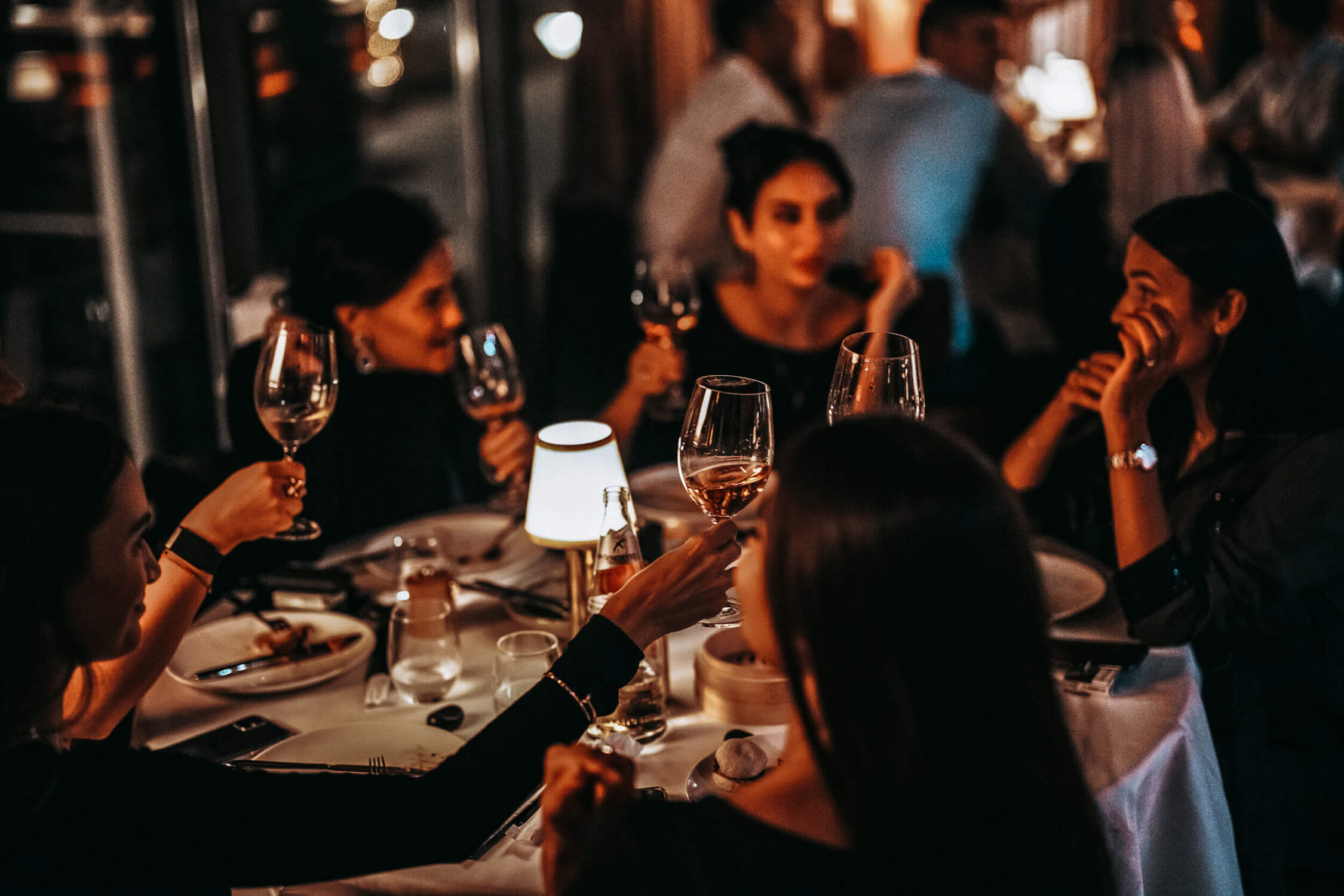 Friends toasting at night